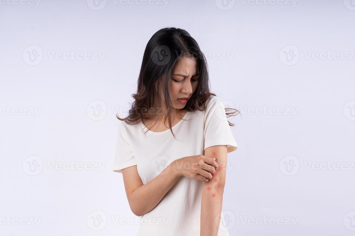 Portrait of Asian woman with itching isolated on white background photo