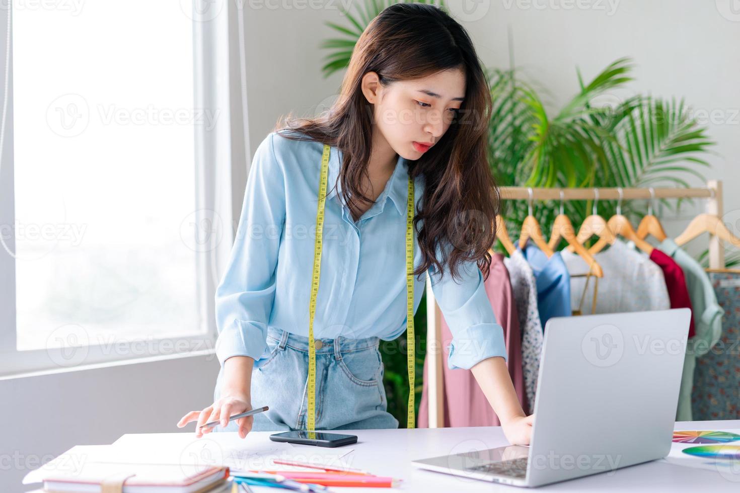 Portrait of a beautiful female fashion designer photo