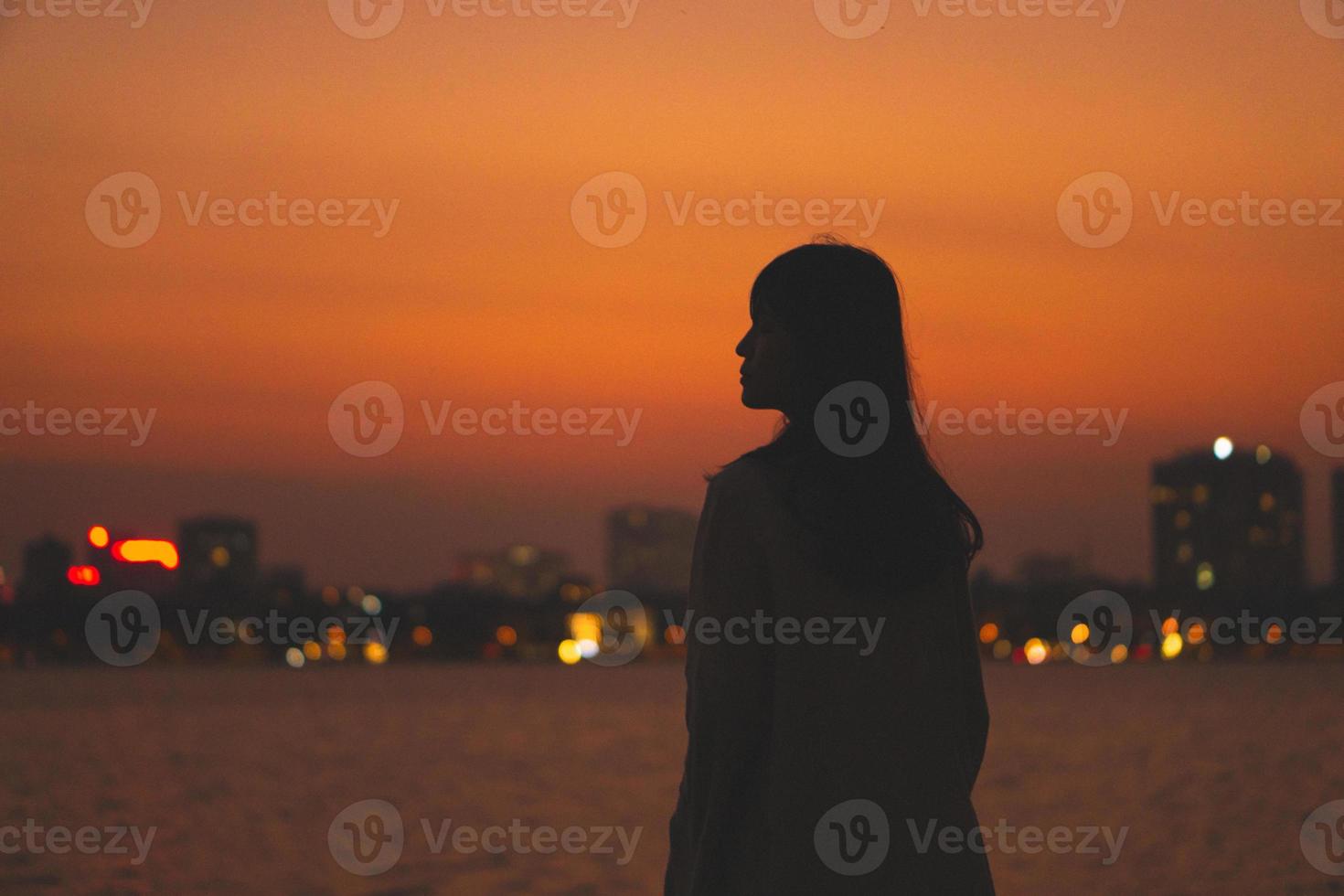 girl silhouette portrait and beautiful sunset photo