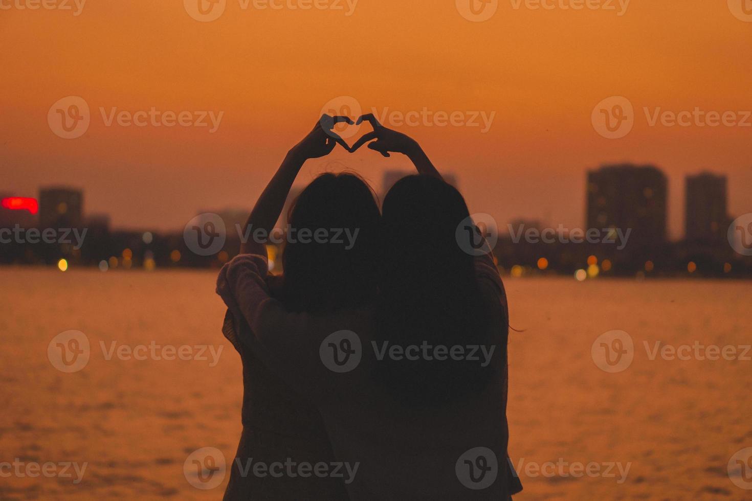 Portrait of a couple and a beautiful sunset photo