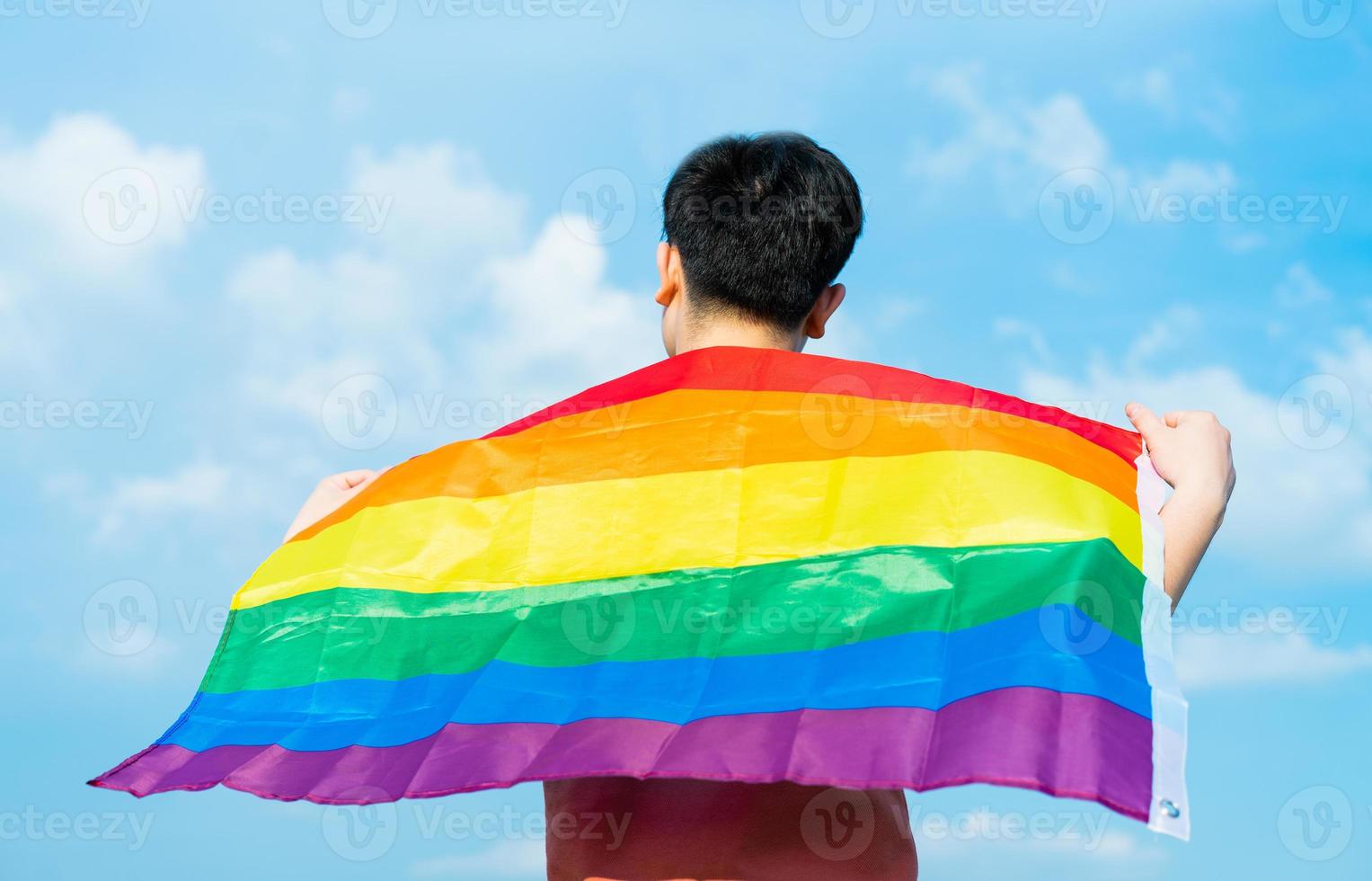 Abstract silhouette of gay man on shoulder is lgbt flag photo