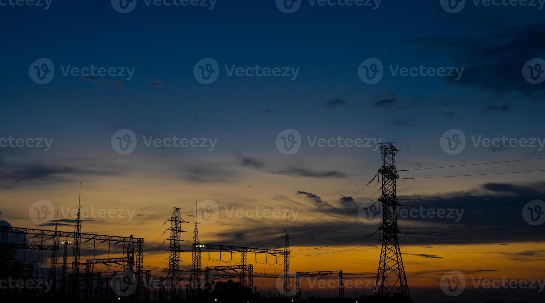 Sun setting over an electrical substation. photo