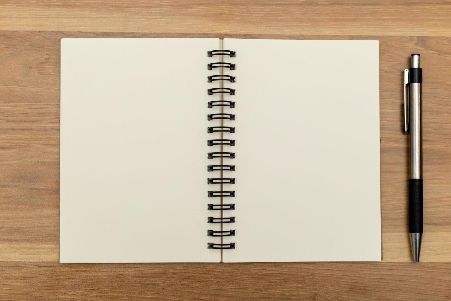 Notebooks and pens are placed on the table photo