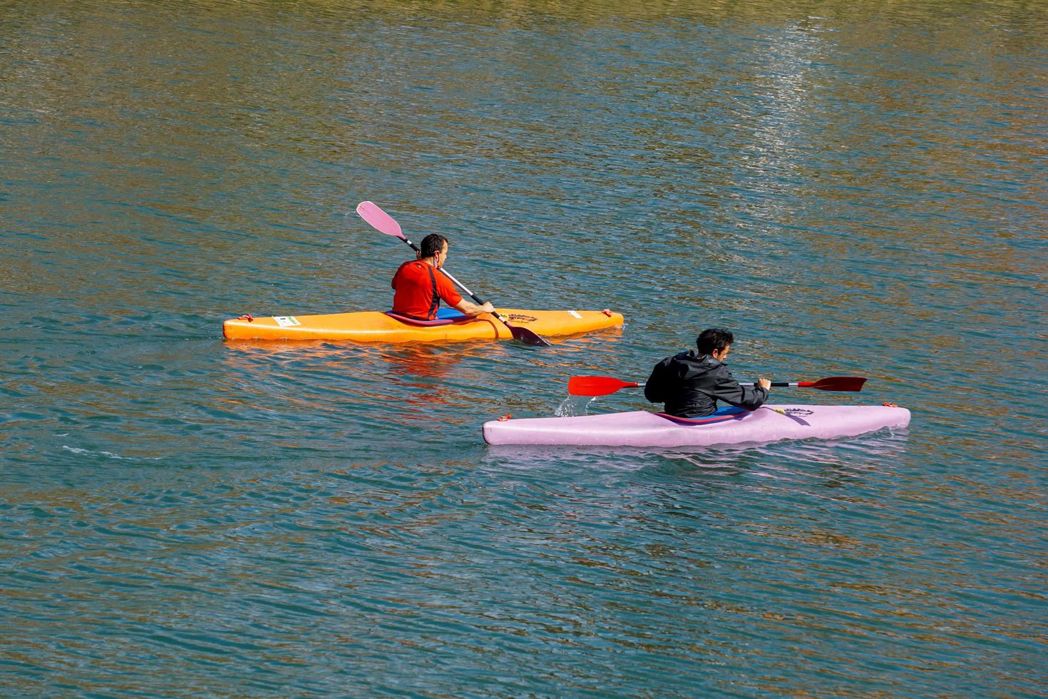 People kayaking on the Bilbao River, Basque country, Spain photo