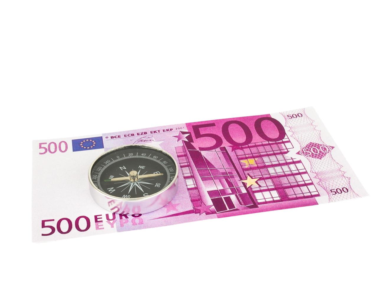 Five hundred 500 Euro bills banknotes with Compass isolated on white background, Clipping path. photo