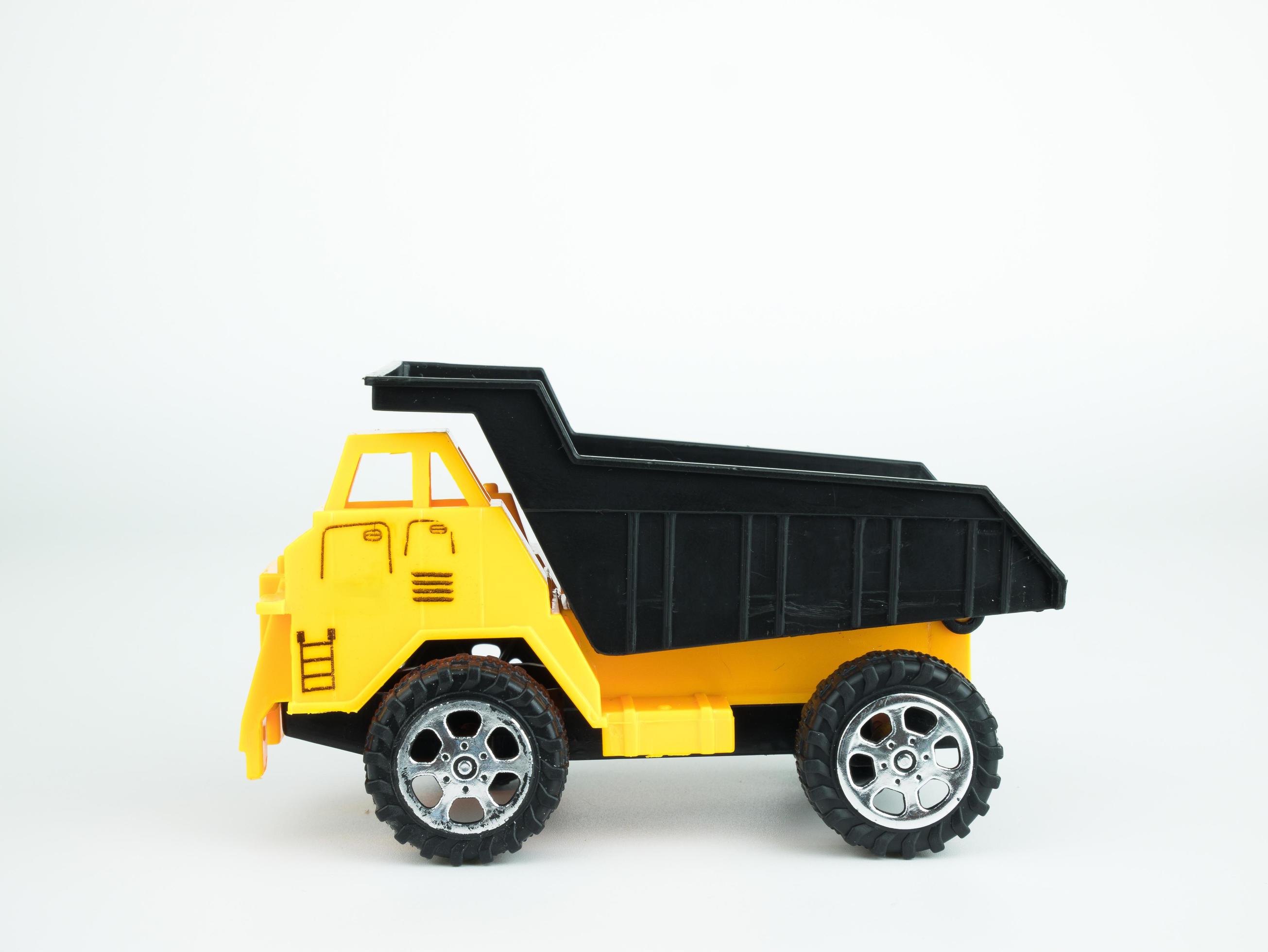 Toy Dump truck on white background, Engineering construction concept