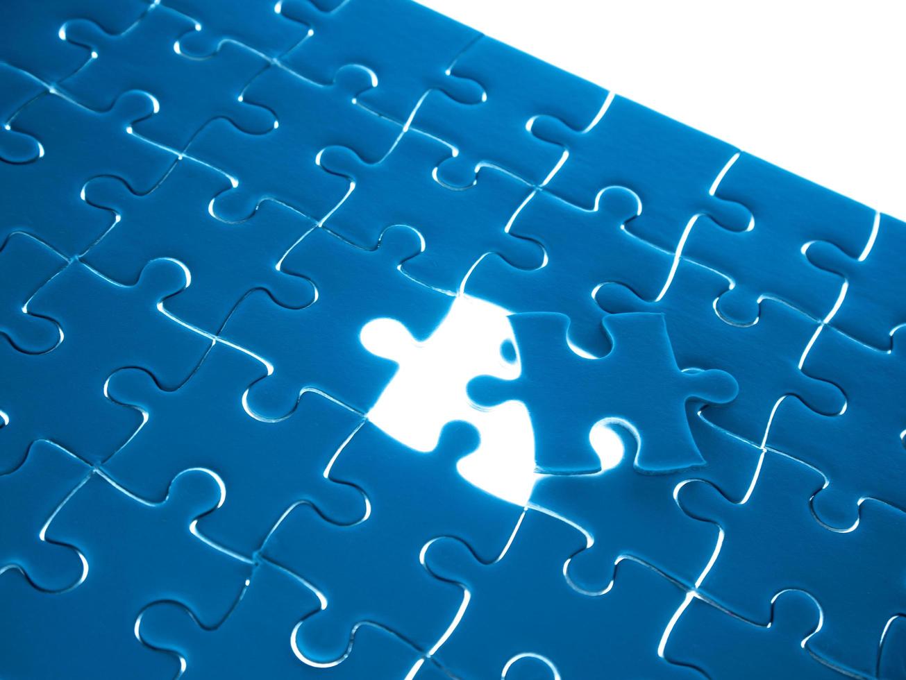 Missing Jigsaw puzzle piece with lighting, business concept for completing the finishing puzzle piece photo