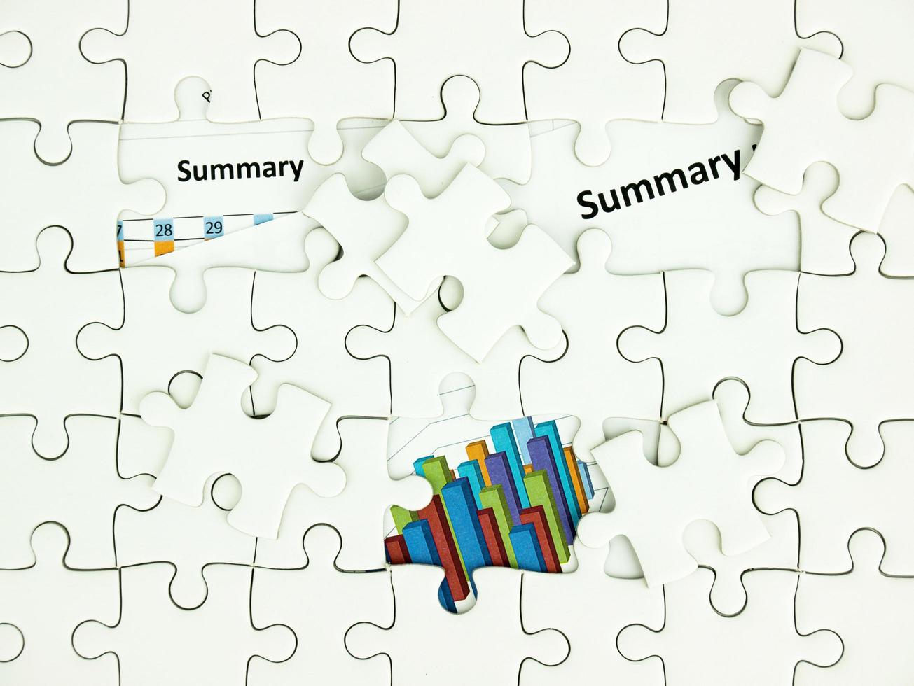 Missing jigsaw puzzle pieces on Graph Calculations background, Key for Business economic success concept photo