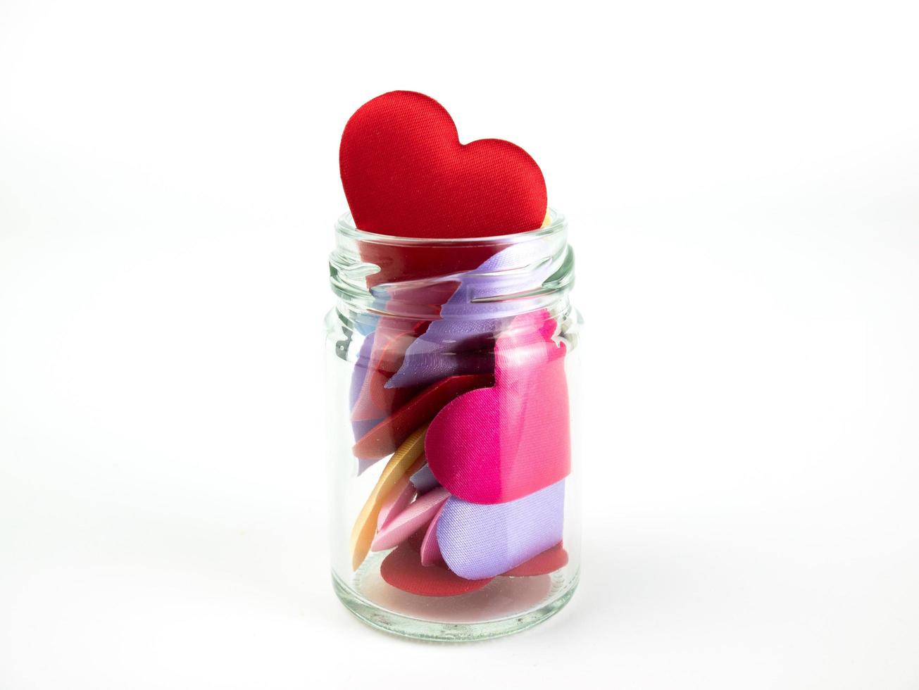 Jar with Colorful mini hearts isolated on white background, Valentine decorations, Various hearts photo