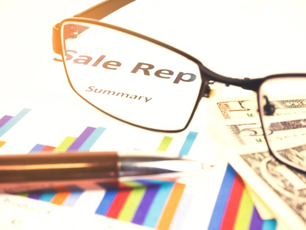 Business chart near dollars by unfocused glasses, Financial concept photo