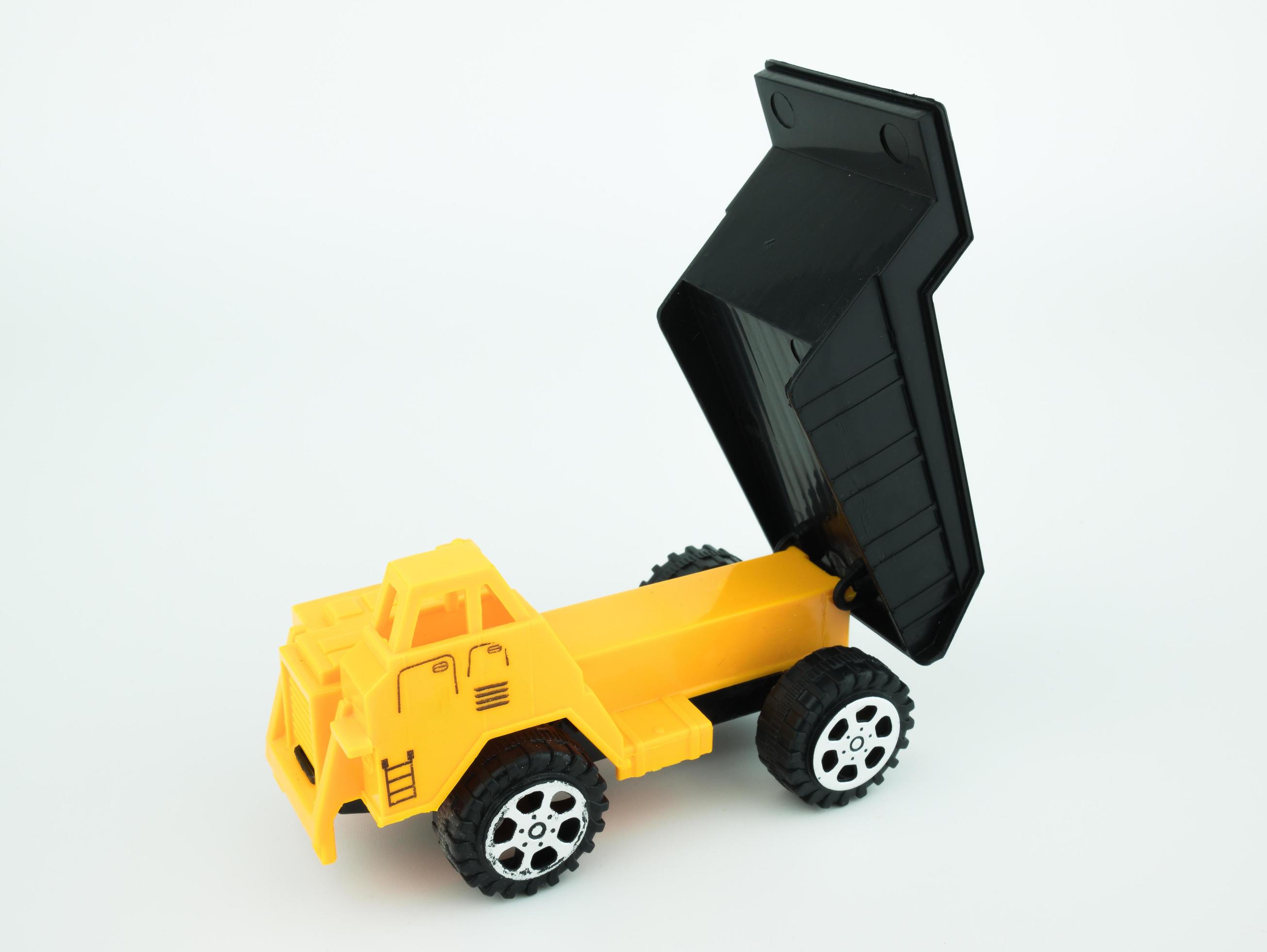 Toy Dump truck on white background, Engineering construction concept