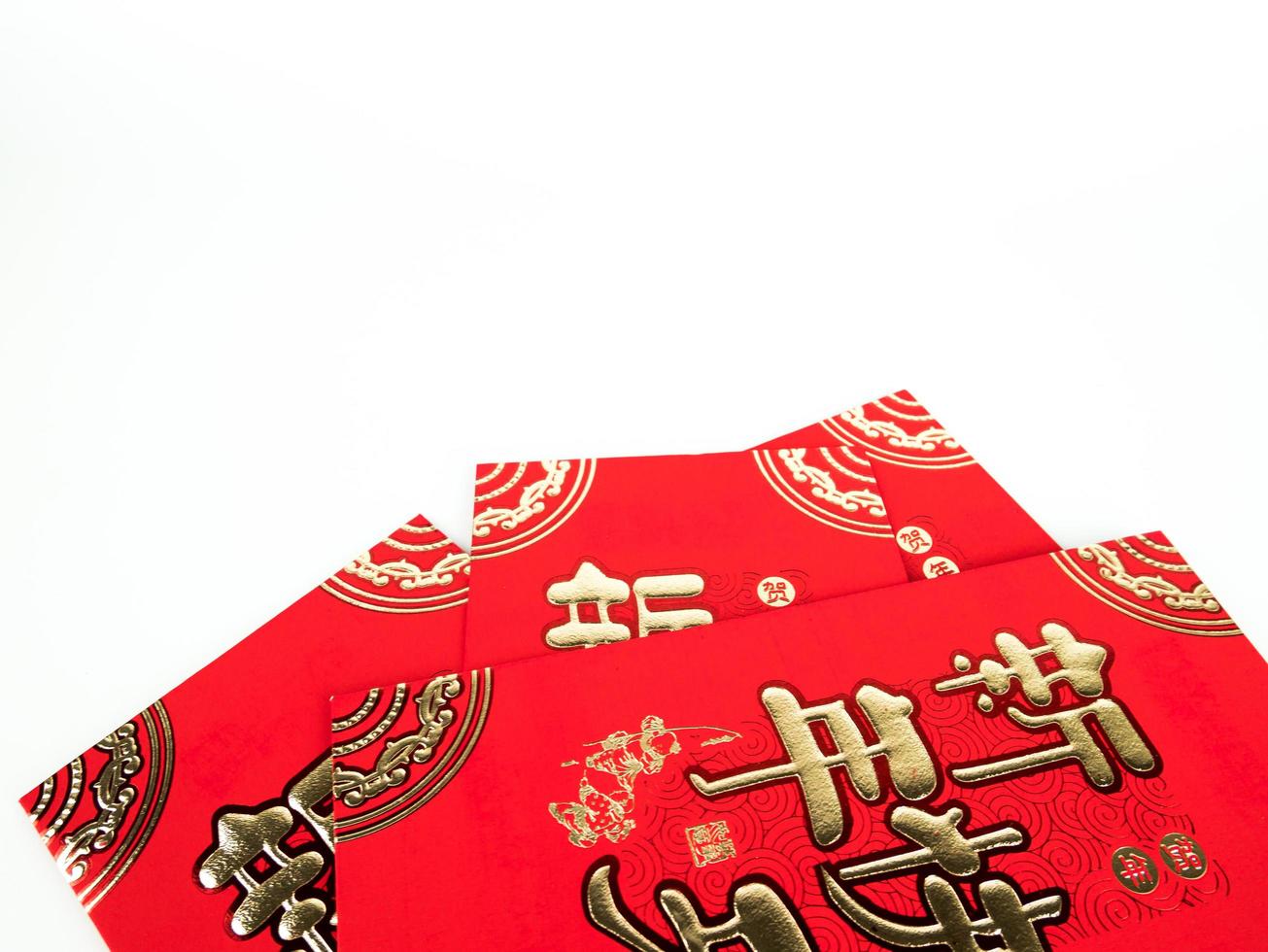 Red envelope isolated on white background for gift Chinese New Year. Chinese text on envelope meaning Happy Chinese New Year photo