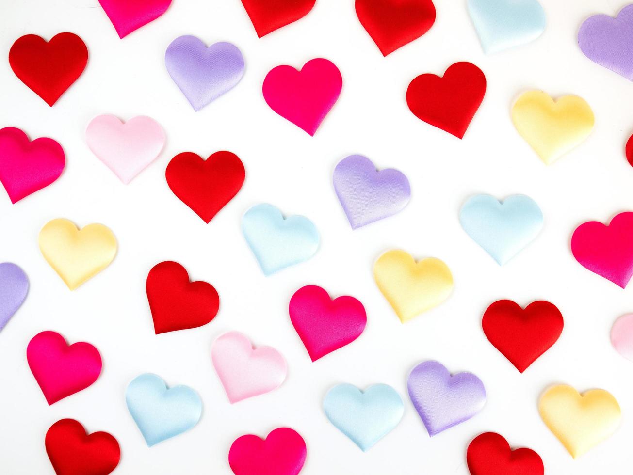 Colorful mini hearts isolated on white background, Valentine decorations, Various hearts photo