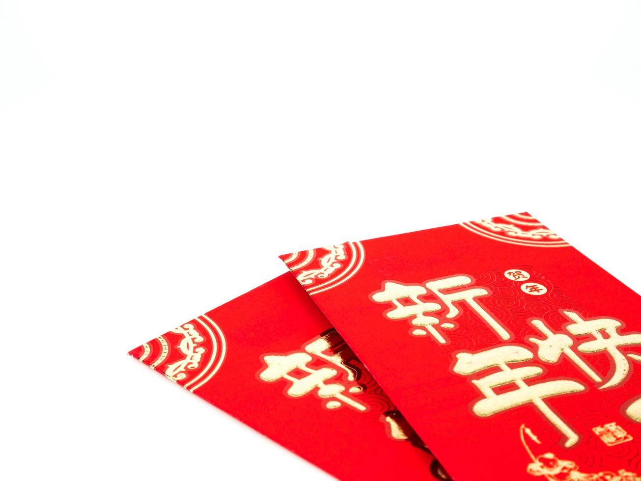 Red envelope isolated on white background for gift Chinese New Year. Chinese text on envelope meaning Happy Chinese New Year photo