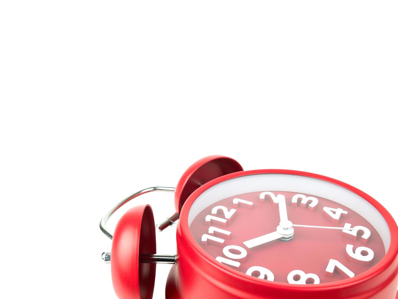 Red Alarm clock falling on white background, Clipping path photo