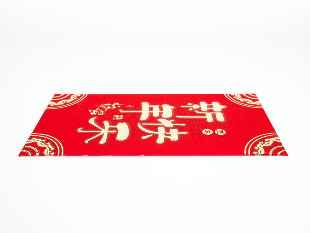 Red envelope isolated on white background for gift Chinese New Year. Chinese text on envelope meaning Happy Chinese New Year photo