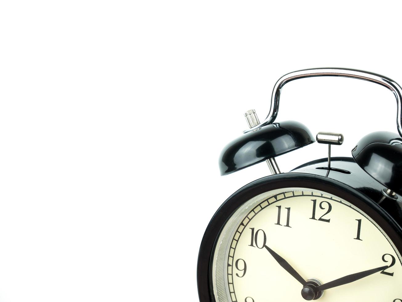 Alarm Clock on white, showing ten o'clock on white background photo