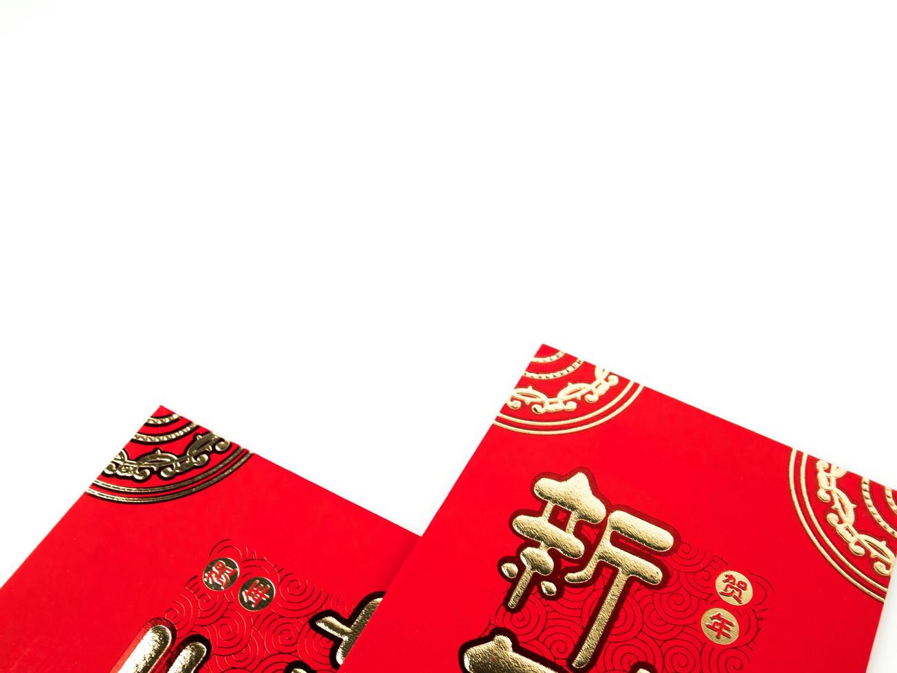 Red envelope isolated on white background for gift Chinese New Year. Chinese text on envelope meaning Happy Chinese New Year photo