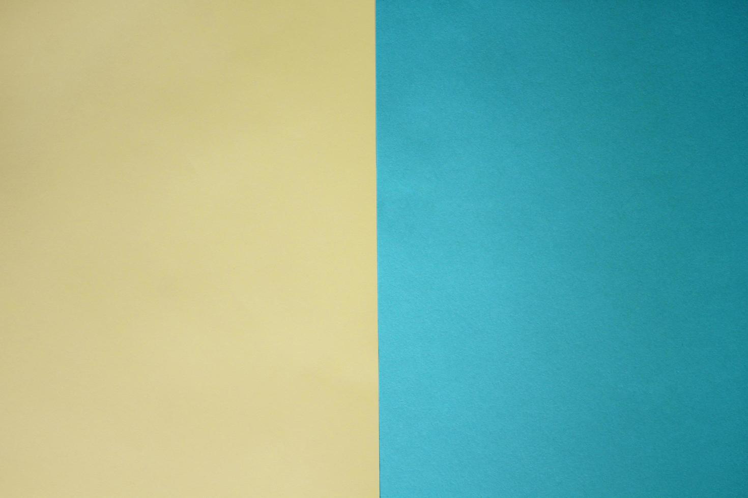 Colored paper yellow and turquoise background. photo