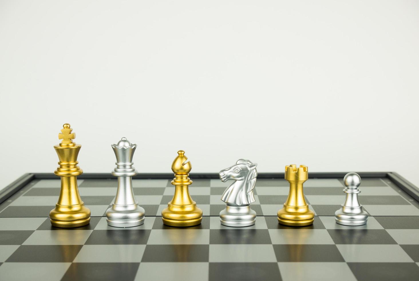 Gold and silver chess pieces photo