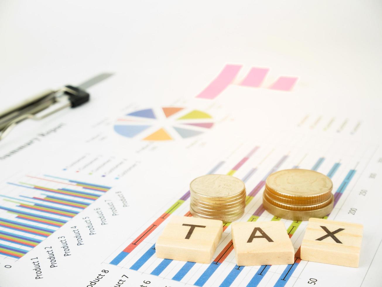 TAX concept with business graph analyst and sale report photo