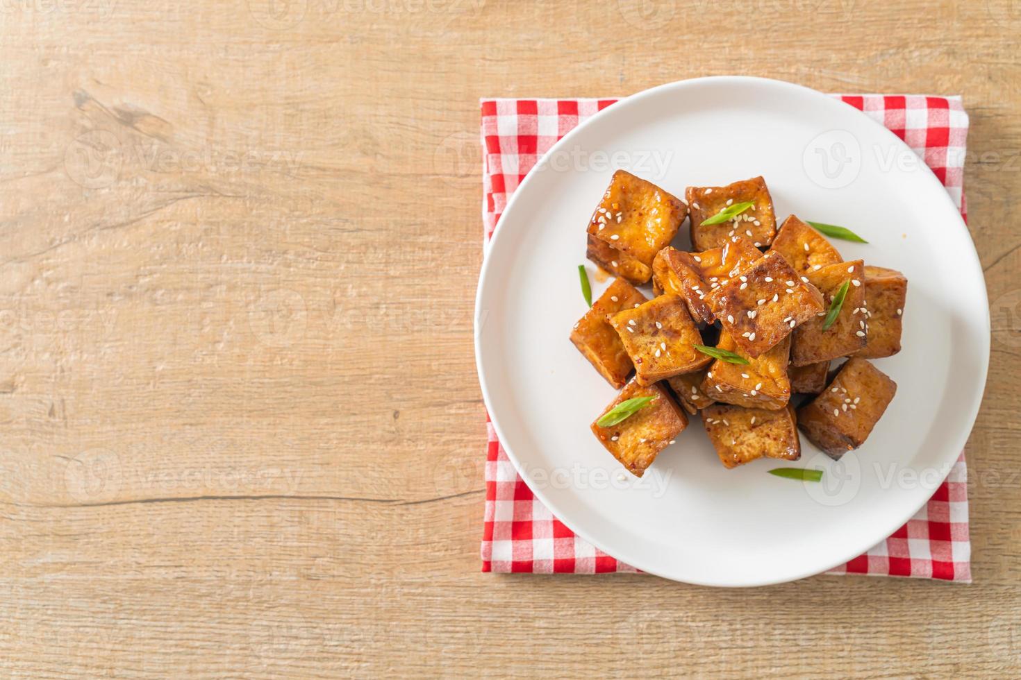 fried tofu with white sesame and teriyaki sauce photo