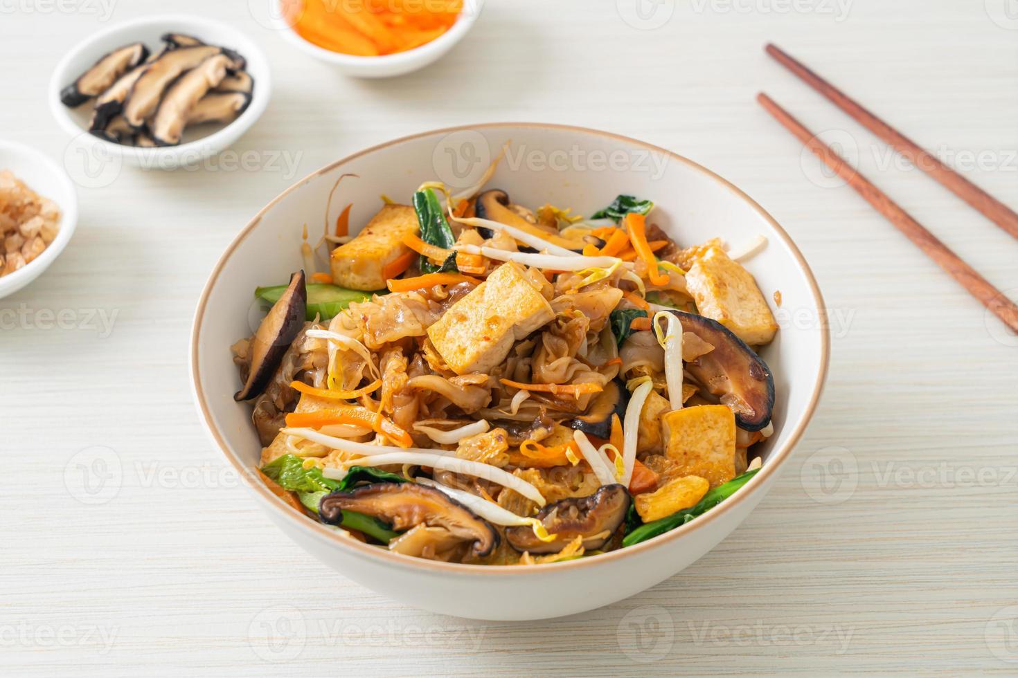 stir-fried noodles with tofu and vegetables photo