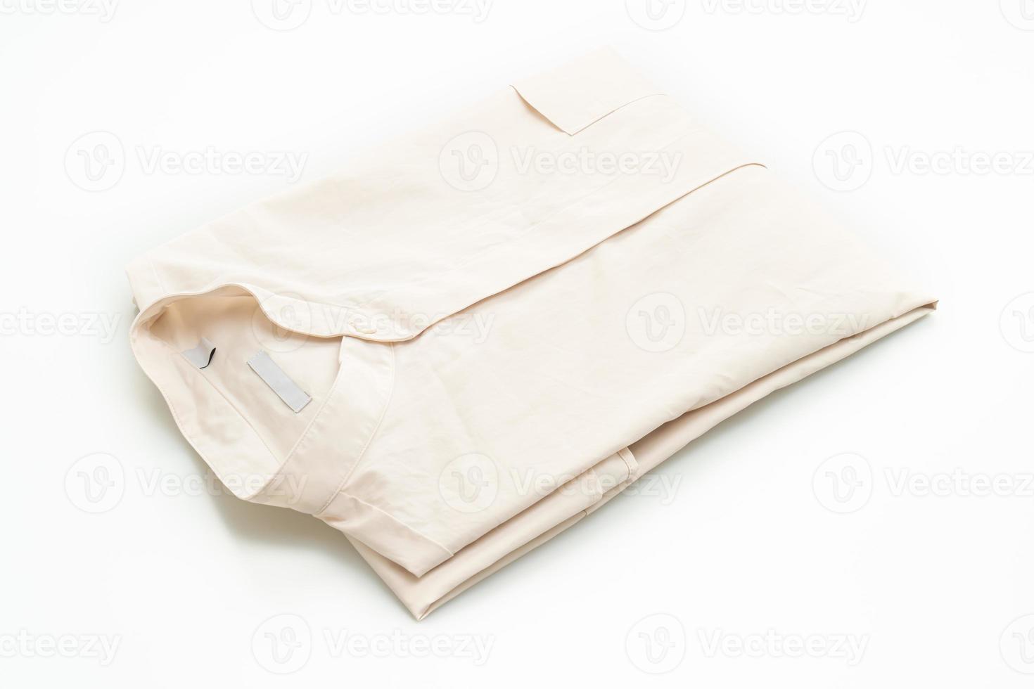 beige shirt fold on white background photo