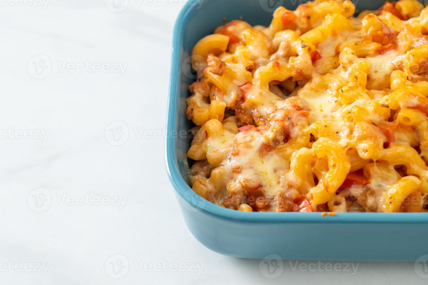 homemade macaroni bolognese with cheese photo