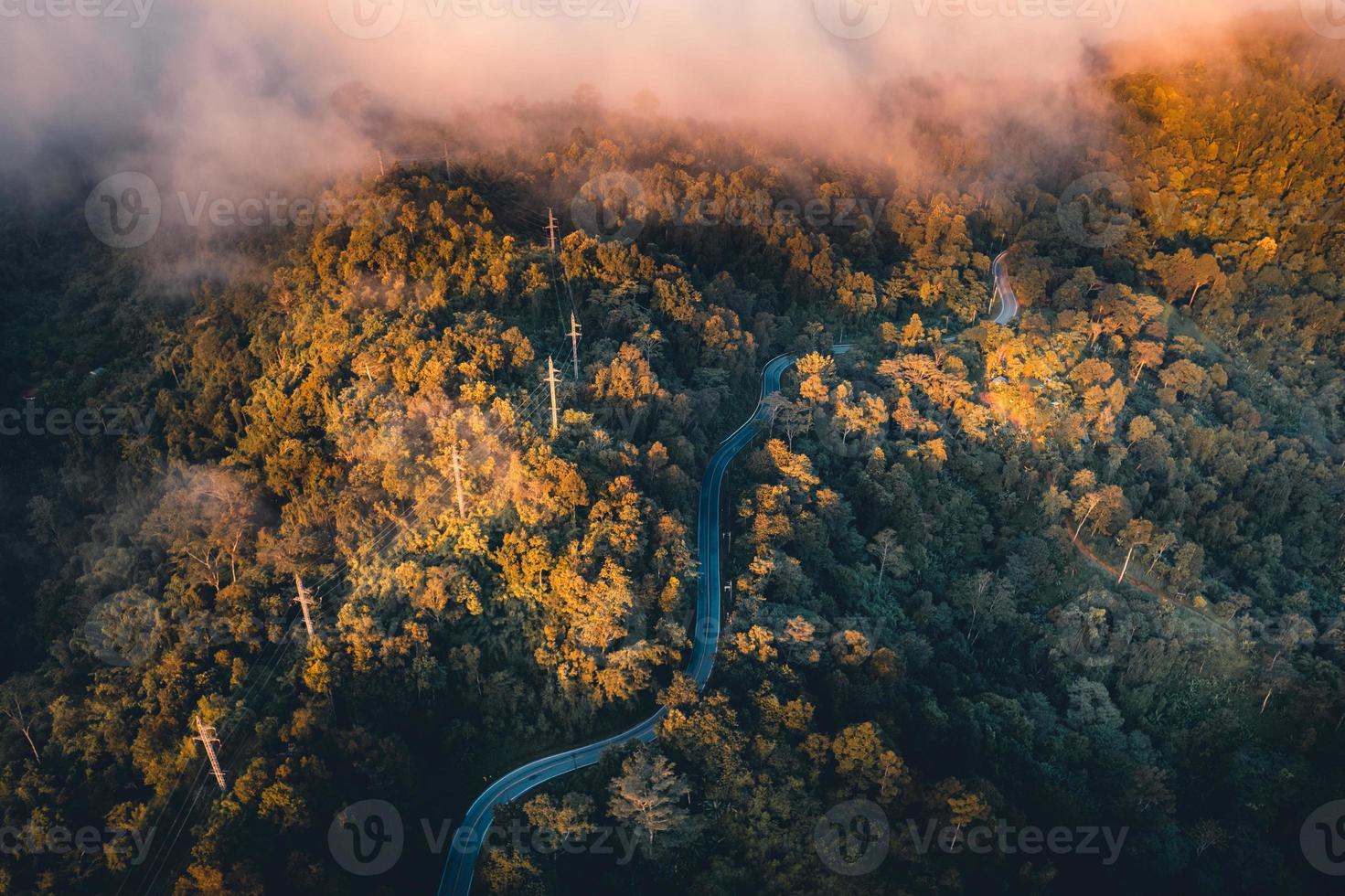 The sun rises in the mist and mountains in the morning photo