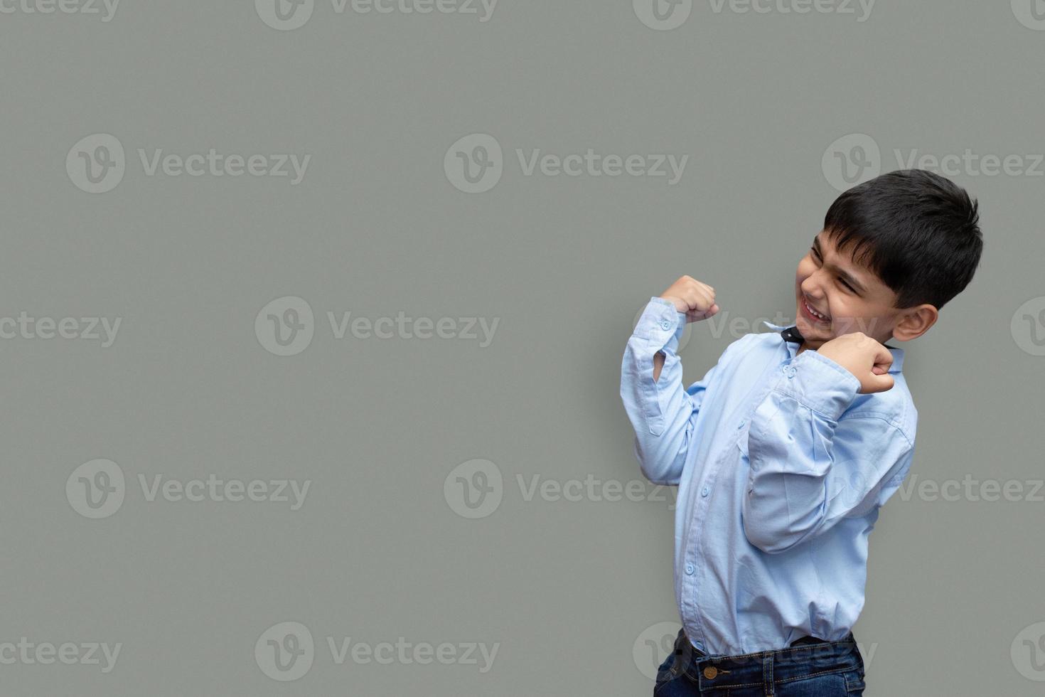 Surprise, excitement and fascination concept. Pakistani Asian little boy shocked with astonishing unexpected news, having amazed look photo