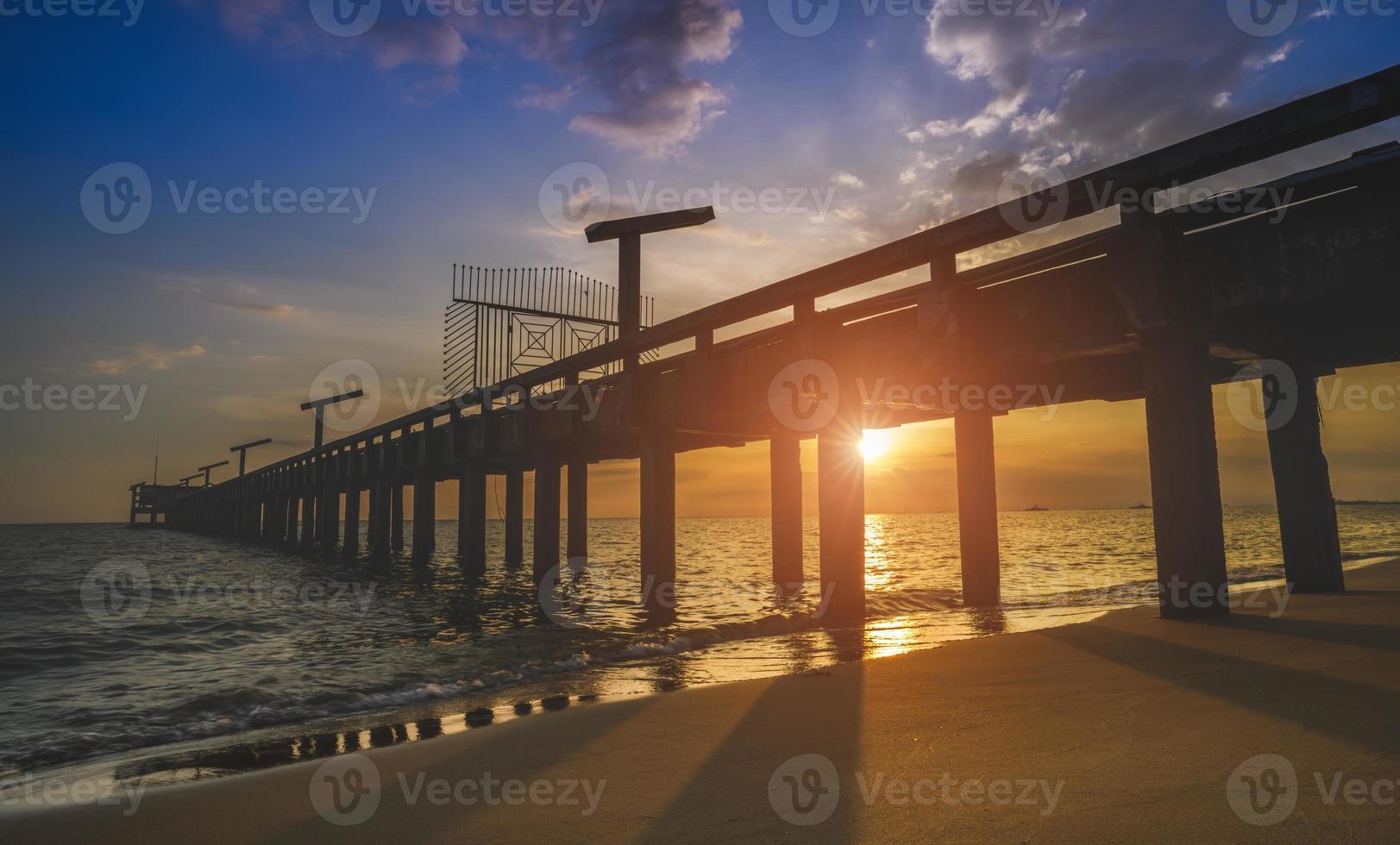 Silhouette long bridge and sky sea scape. photo