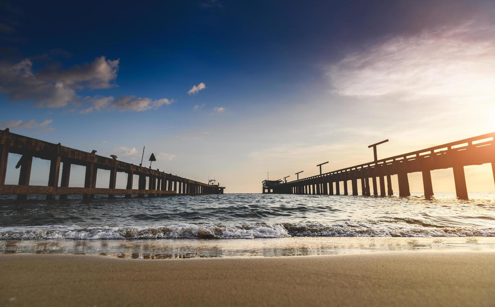 Silhouette long bridge and sky sea scape. photo