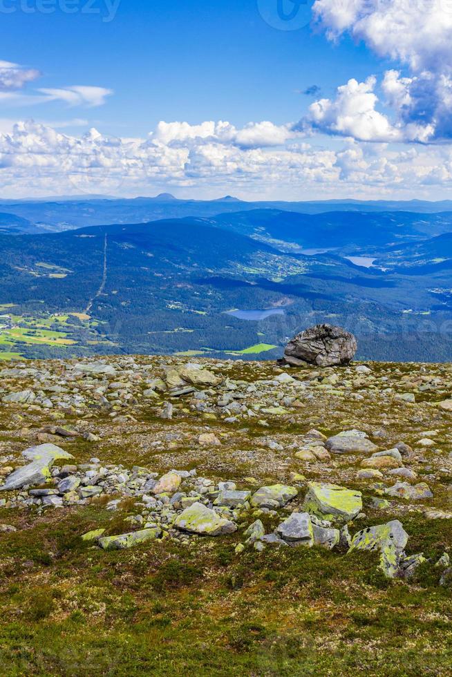 Big rock in amazing norwegian landscape mountain top Vang Norway. photo