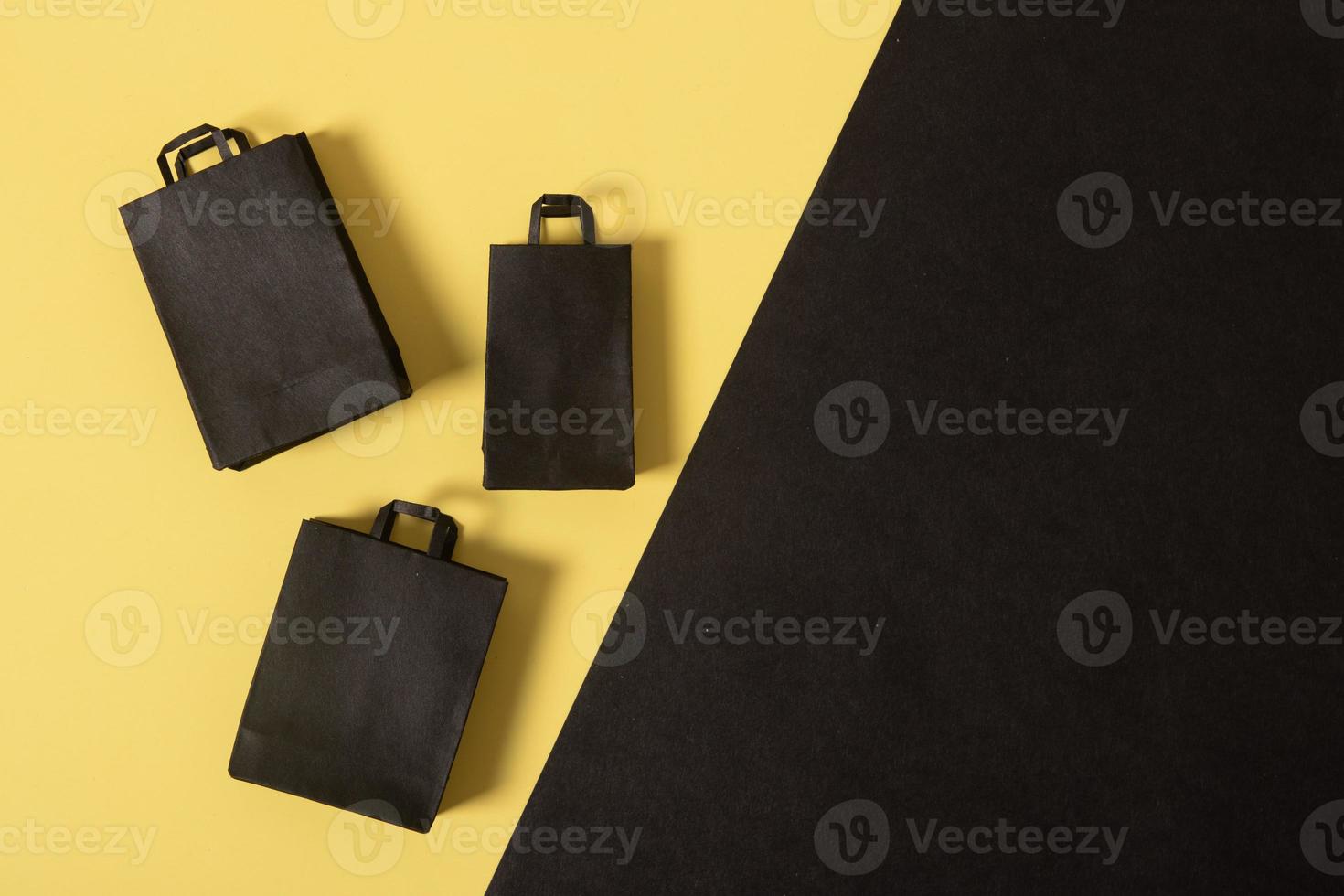 Black friday sale miniature mock up shopping bags black and yellow flat lay photo