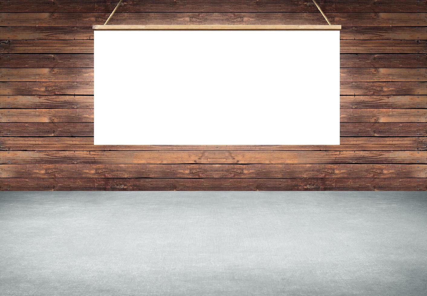 Table with hanging white poster sign on wooden wall photo