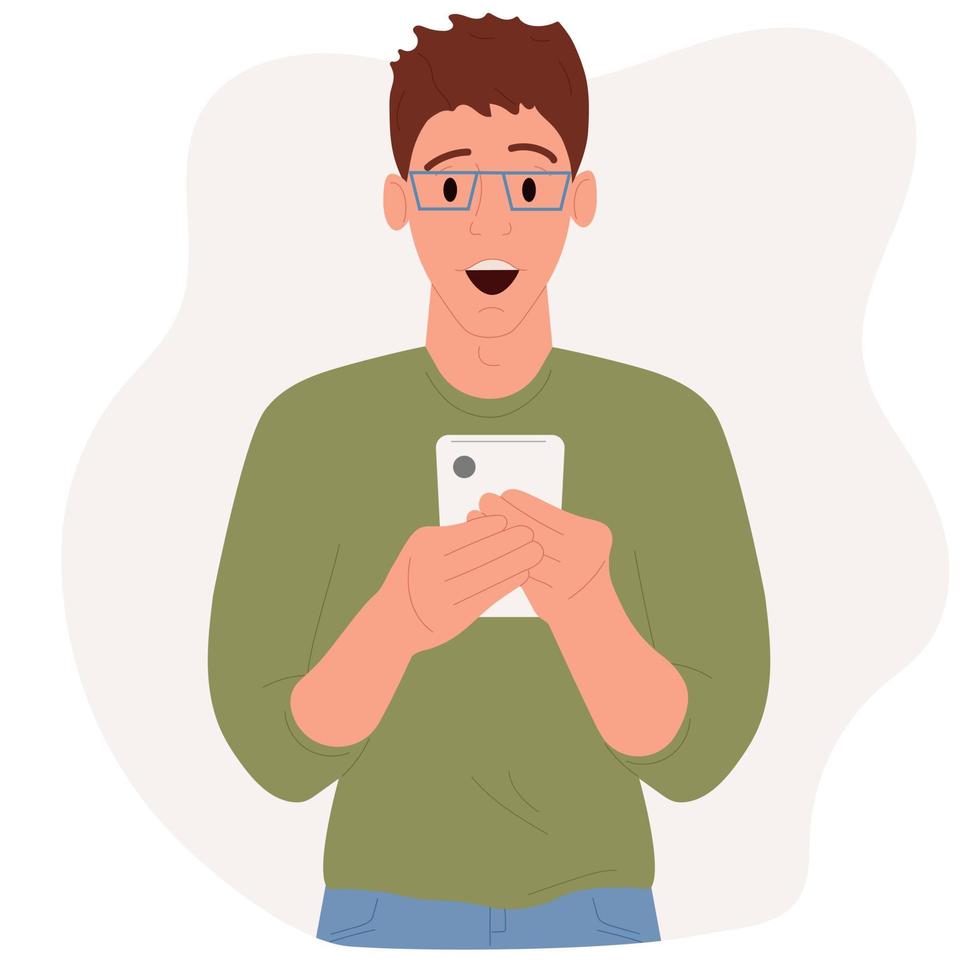 Young guy, with a surprised expression on his face, holds a smartphone in his hands. vector