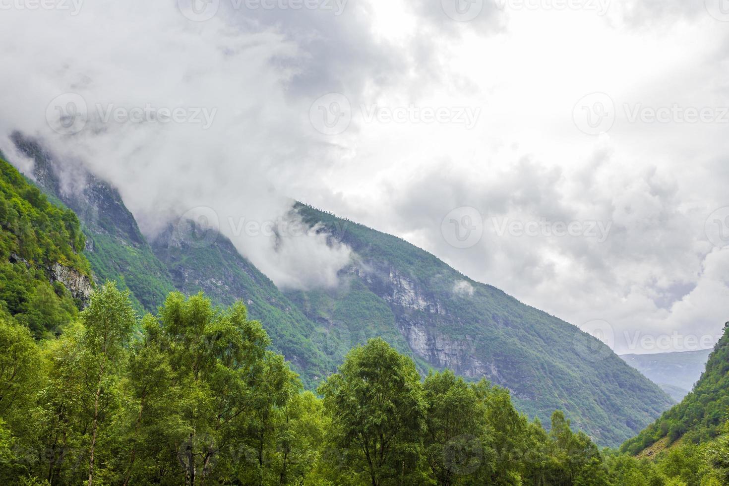 Fog mist clouds cliffs on mountain norwegian landscape Utladalen Norway. photo