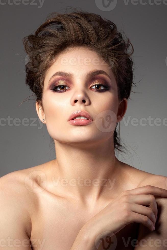 Portrait of beautiful woman with evening makeup photo