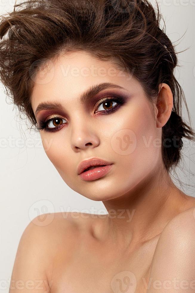 Portrait of beautiful woman with evening makeup photo