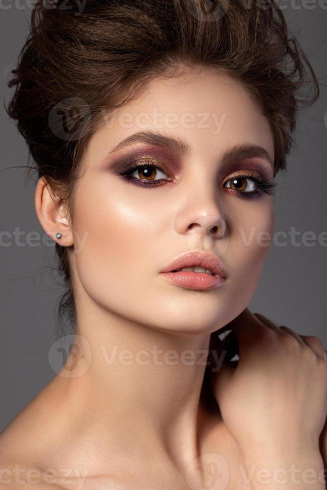 Portrait of beautiful woman with evening makeup photo