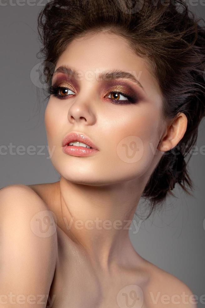 Portrait of beautiful woman with evening makeup photo