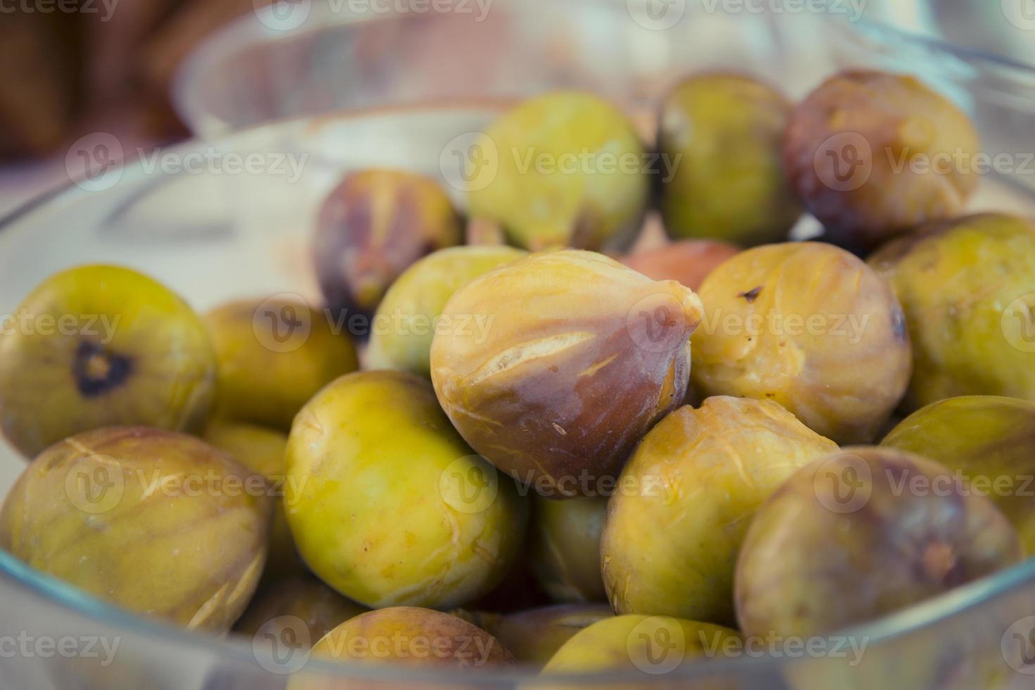 Close up on figs in a glass bowl photo