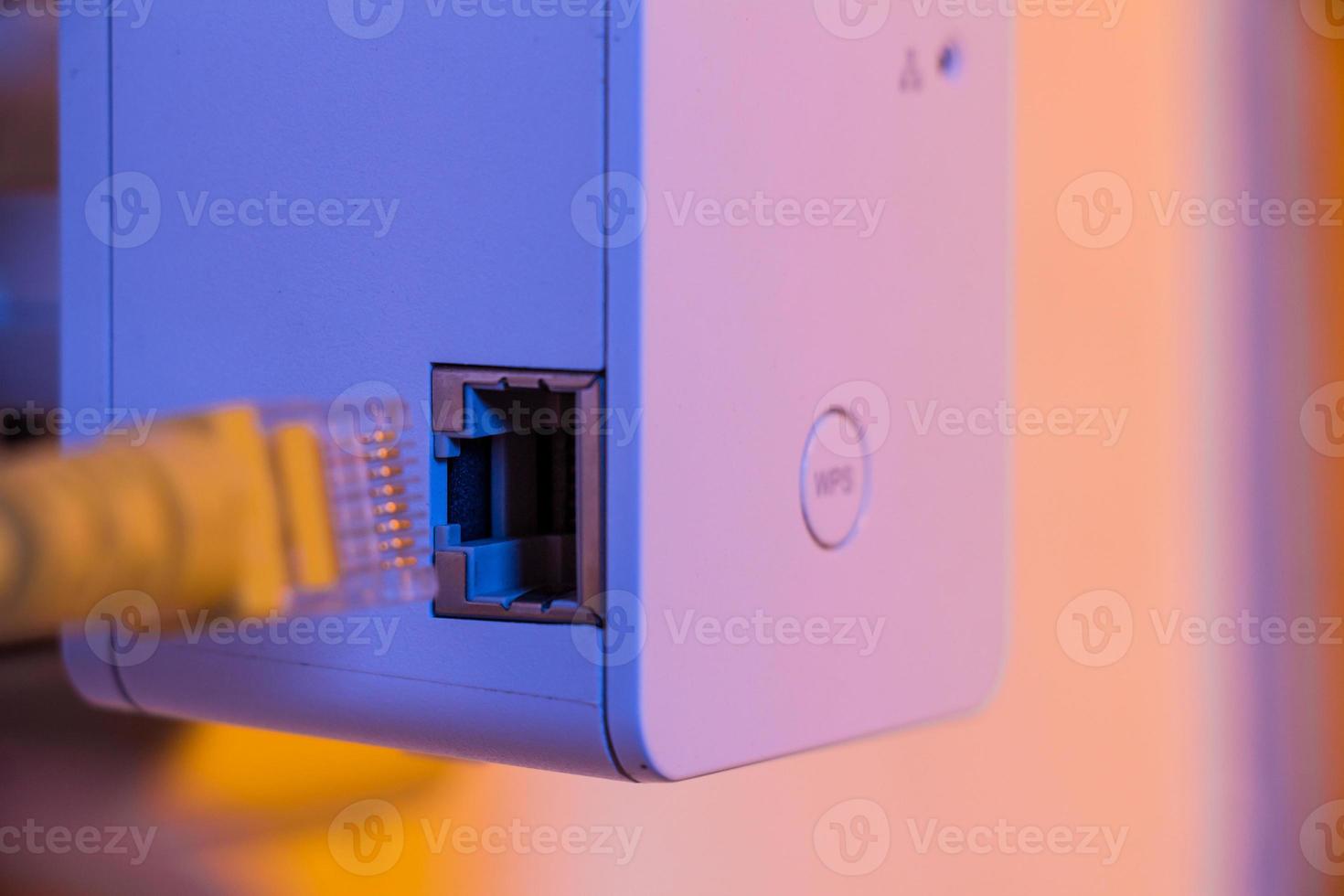 Insert cable into WiFi extender device which is in electrical