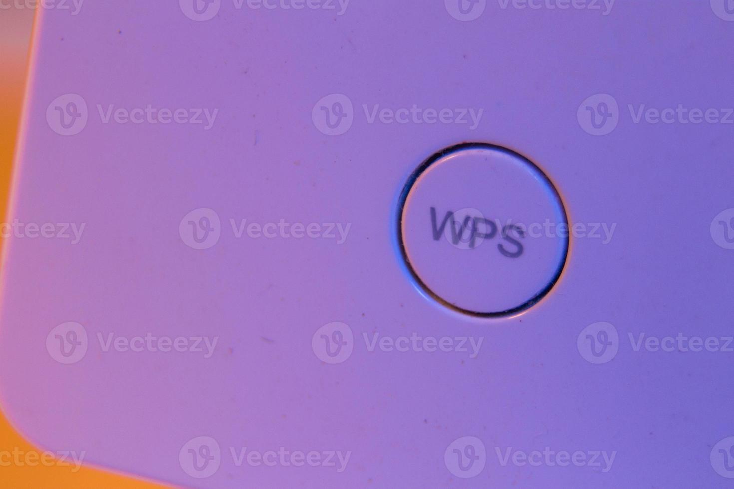 Macro closeup on WiFi repeater WPS button photo