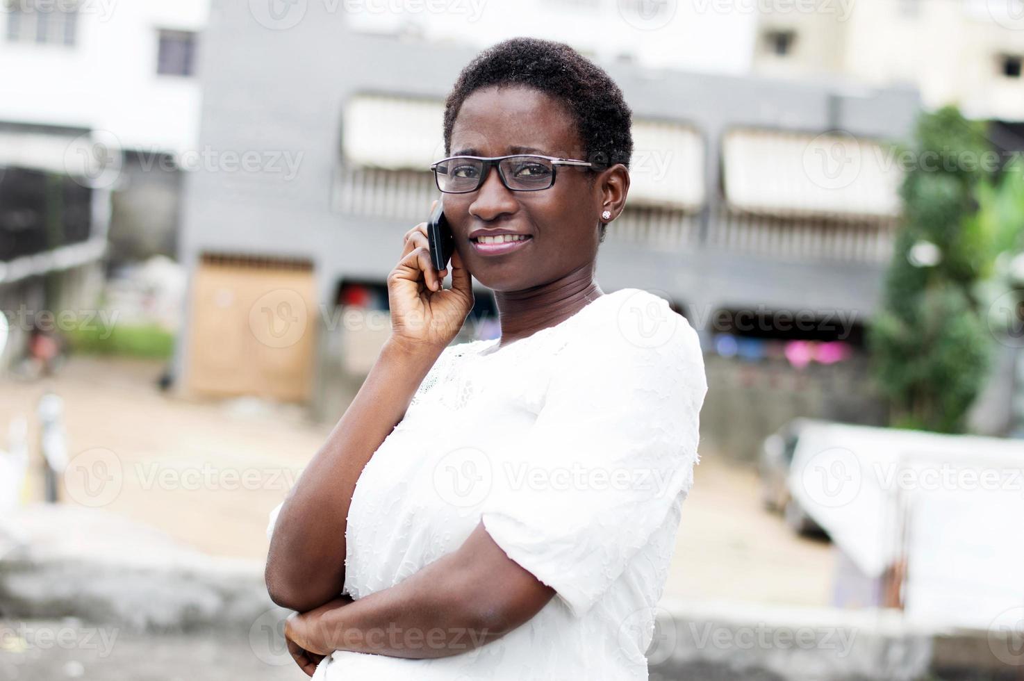 young woman on the phone with a smile. photo