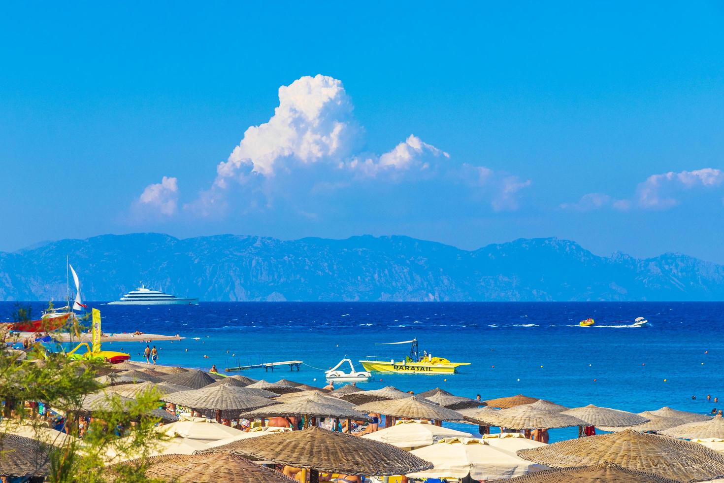 Elli beach tourism Rhodes Greece turquoise water and Turkey view. photo