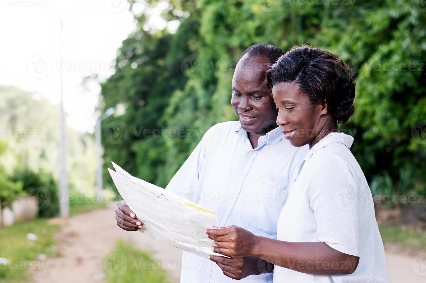 happy young couple consult a regional map. photo