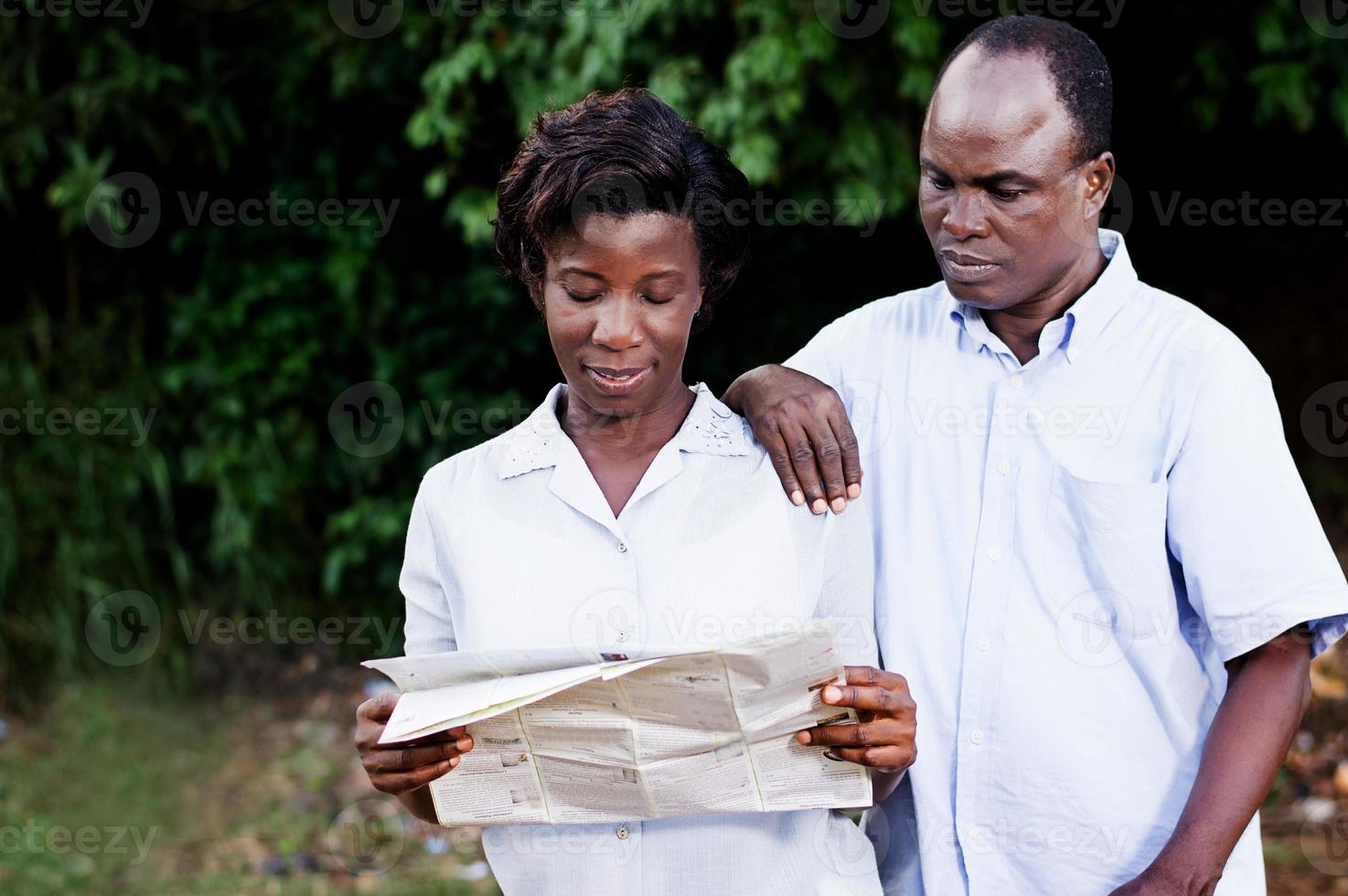 young coupletraveling consult a map. photo