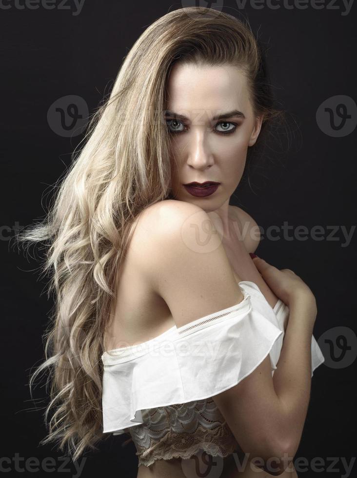 Young woman with long hair and blue eyes photo